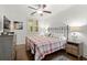 Charming bedroom featuring a patterned quilt, vintage-style furniture, and natural light from shuttered windows at 420 Banbury Xing, Alpharetta, GA 30009