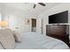 Bedroom features a mounted tv, crown molding, and a walk-in closet at 420 Banbury Xing, Alpharetta, GA 30009