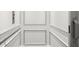 Interior view of a home elevator, featuring white paneling and hand railing at 420 Banbury Xing, Alpharetta, GA 30009