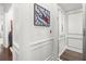 Elevator area with decorative molding, hardwood floors, and an appealing painting at 420 Banbury Xing, Alpharetta, GA 30009
