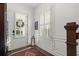 Bright entryway with plantation shutters, decorative rug, and stylish accents, creating an elegant first impression at 420 Banbury Xing, Alpharetta, GA 30009