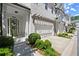 Charming townhome exterior with two-car garage and manicured landscaping at 420 Banbury Xing, Alpharetta, GA 30009