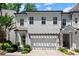 Charming two-story home with a two-car garage, a pergola, and landscaped front yard at 420 Banbury Xing, Alpharetta, GA 30009