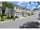 Street view of townhomes with two-car garages and manicured landscaping at 420 Banbury Xing, Alpharetta, GA 30009