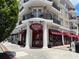 Charming multi-story building with inviting Kilwins storefront and red awnings, offering an appealing commercial space at 420 Banbury Xing, Alpharetta, GA 30009