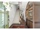 Elegant foyer with staircase, hardwood floors, and stylish decor at 420 Banbury Xing, Alpharetta, GA 30009
