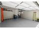 An open garage with ample space, epoxy flooring and equipped with ceiling storage units, ready for versatile use at 420 Banbury Xing, Alpharetta, GA 30009