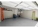 Clean and spacious garage featuring epoxy flooring, overhead storage, and ample room at 420 Banbury Xing, Alpharetta, GA 30009