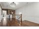 Elegant hallway with hardwood floors, wainscoting, and a decorative chandelier at 420 Banbury Xing, Alpharetta, GA 30009