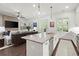 Bright kitchen with granite counters, stainless appliances, and open to the living room at 420 Banbury Xing, Alpharetta, GA 30009