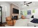 Cozy living room featuring a brick fireplace, large windows, and comfortable seating at 420 Banbury Xing, Alpharetta, GA 30009