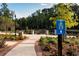 A beautifully landscaped path with brick accents and lush plantings guides you through the community at 420 Banbury Xing, Alpharetta, GA 30009