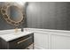 Elegant powder room featuring modern vanity, stylish fixtures, and designer wallpaper at 420 Banbury Xing, Alpharetta, GA 30009