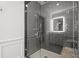 Modern shower with gray subway tile, glass enclosure, and granite bench at 420 Banbury Xing, Alpharetta, GA 30009