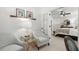 An additional sitting area just off the main bedroom features two upholstered chairs and glass side tables at 420 Banbury Xing, Alpharetta, GA 30009