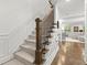 Staircase with wooden handrail, and carpeted stairs at 420 Banbury Xing, Alpharetta, GA 30009