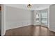 Bright dining room featuring beautiful hardwood floors, modern lighting, and wainscoting at 535 Watercress Dr, Woodstock, GA 30188