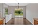Sun-lit dining room with hardwood floors and sliding glass doors that lead to the backyard at 535 Watercress Dr, Woodstock, GA 30188