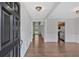 Elegant foyer with hardwood floors, white wainscoting, and a view into other rooms at 535 Watercress Dr, Woodstock, GA 30188