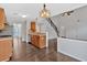 Open-concept kitchen with wood cabinets, stainless steel appliances, and a center island with a sink at 535 Watercress Dr, Woodstock, GA 30188
