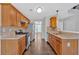 Charming kitchen features stainless steel appliances, granite countertops, and wood cabinets at 535 Watercress Dr, Woodstock, GA 30188