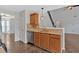 Kitchen boasts updated countertops, stainless steel appliances, and views of the home's staircase at 535 Watercress Dr, Woodstock, GA 30188