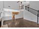 Spacious living room with tall ceilings, grand staircase, and an open view of the kitchen at 535 Watercress Dr, Woodstock, GA 30188