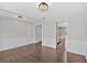 Inviting living room with hardwood floors, white trim and a view of the kitchen at 535 Watercress Dr, Woodstock, GA 30188