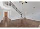Large living room featuring soaring ceilings, a grand staircase, and hardwood floors at 535 Watercress Dr, Woodstock, GA 30188