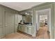 Chic bar area with stylish countertops and a view into the adjacent kitchen, offering a sophisticated space for entertaining at 5759 Albans Way, Lithonia, GA 30058