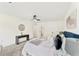 Bright bedroom features neutral decor, carpeted floor, fan, and furniture at 5759 Albans Way, Lithonia, GA 30058