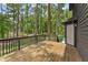 Wooden deck offers outdoor relaxation space, perfect for enjoying the wooded surroundings of this home at 5759 Albans Way, Lithonia, GA 30058