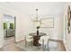 Dining room with modern lighting and access to kitchen at 5759 Albans Way, Lithonia, GA 30058