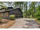 Spacious two-car garage with ample parking and beautiful wooded views, perfect for car enthusiasts or storage at 5759 Albans Way, Lithonia, GA 30058