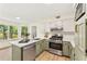 Updated kitchen with stainless steel appliances, light countertops, and bright view at 5759 Albans Way, Lithonia, GA 30058