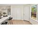 Bright kitchen nook with breakfast bar, storage closet, and backyard view at 5759 Albans Way, Lithonia, GA 30058