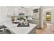 Bright kitchen with light cabinets, modern appliances, and a breakfast bar, perfect for culinary enthusiasts and casual dining at 5759 Albans Way, Lithonia, GA 30058