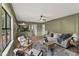 Inviting living room with wainscotting, neutral color palette, and a bar area, perfect for relaxation and entertaining at 5759 Albans Way, Lithonia, GA 30058