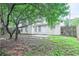 A spacious backyard with a lawn, a patio, and a privacy fence at 5779 Wellborn Creek Dr, Lithonia, GA 30058
