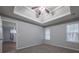 Bedroom featuring ceiling fan, trey ceilings, plush carpet, and natural light at 5779 Wellborn Creek Dr, Lithonia, GA 30058