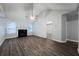 Bright living room features a fireplace and smooth dark floors at 5779 Wellborn Creek Dr, Lithonia, GA 30058