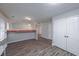 Bright living room featuring hardwood floors, vaulted ceilings and neutral paint scheme at 5779 Wellborn Creek Dr, Lithonia, GA 30058
