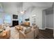 Bright living room with fireplace, ceiling fan, and doorway to a bedroom at 5779 Wellborn Creek Dr, Lithonia, GA 30058
