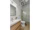 Modern bathroom features a sleek vanity, toilet, and glass-enclosed tiled shower at 820 Dekalb Ne Ave # 2, Atlanta, GA 30307