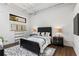 Stylishly designed bedroom with a modern bed, area rug, and unique artwork at 820 Dekalb Ne Ave # 2, Atlanta, GA 30307