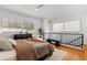 Bright bedroom boasts a ceiling fan, hardwood floors, and natural light through plentiful windows at 820 Dekalb Ne Ave # 2, Atlanta, GA 30307