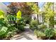 Exterior image displaying a lush green walkway with mature trees and landscaping at 820 Dekalb Ne Ave # 2, Atlanta, GA 30307