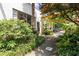Attractive exterior with a garden, walkway, and mature trees, providing an inviting entrance to the property at 820 Dekalb Ne Ave # 2, Atlanta, GA 30307
