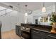 Open kitchen with granite countertops, stainless steel appliances, and staircase access at 820 Dekalb Ne Ave # 2, Atlanta, GA 30307