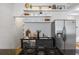 Well-lit kitchen area with stainless steel appliances, granite countertops, and open shelving at 820 Dekalb Ne Ave # 2, Atlanta, GA 30307